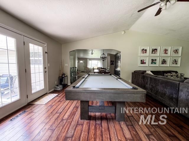 808 O'Leary Way Twin Falls, ID 83301 - Photo 16 of 37 Spacious room with wood-finish flooring, vaulted ceilings, and an arched doorway