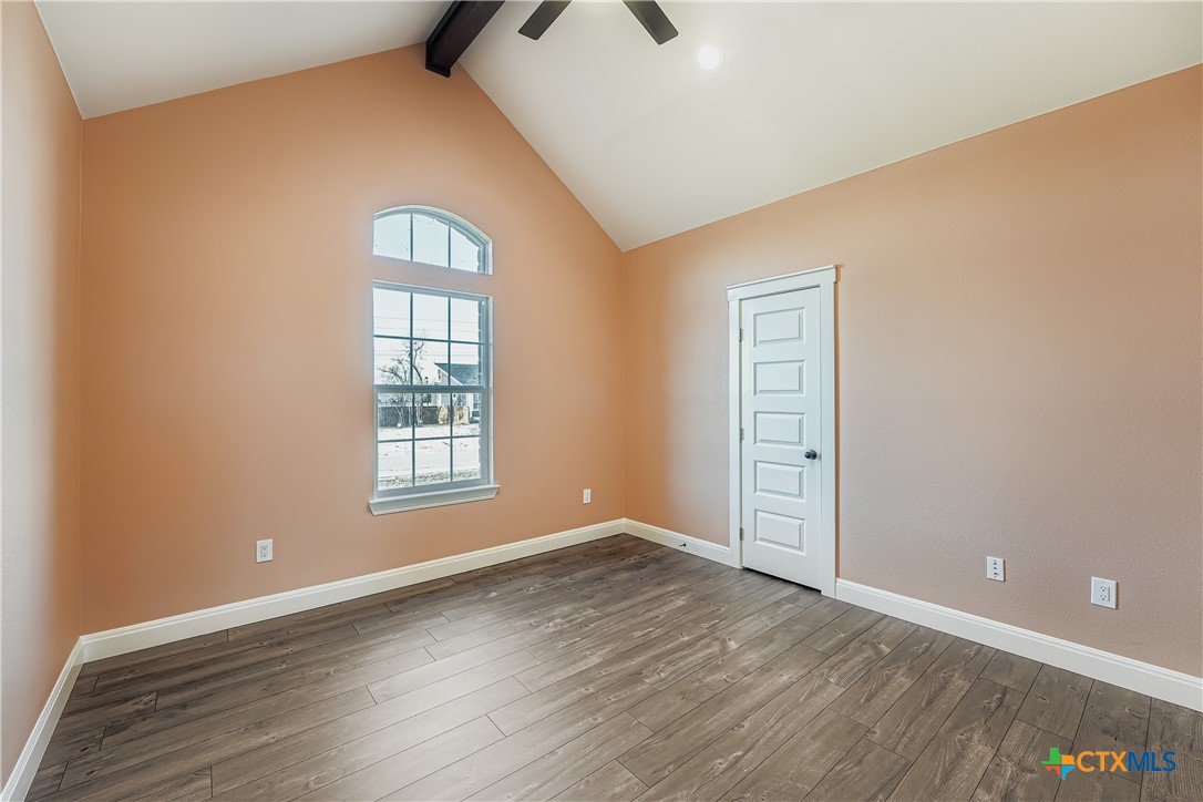 222 Arosa Drive Elgin, TX 78621 - Photo 28 of 40 wooden floor in an empty room with a window