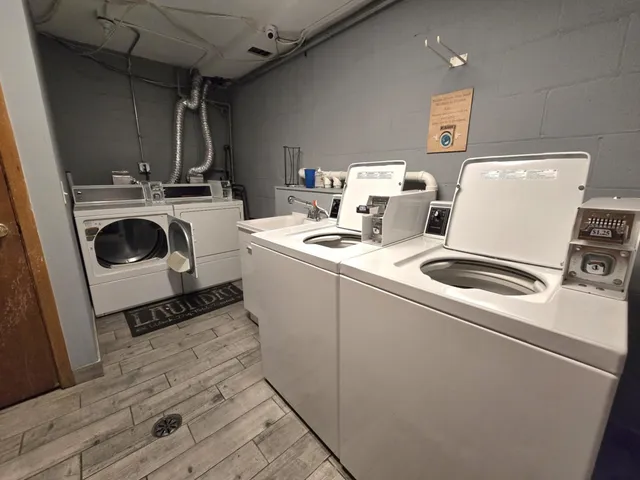 a room with a washing machine and sink