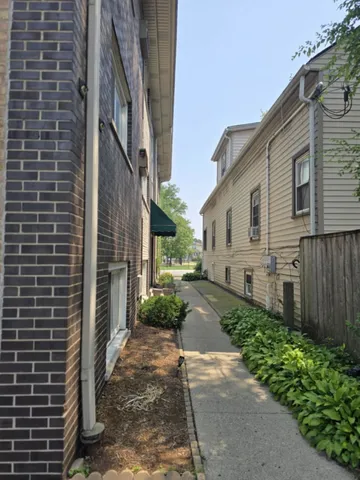 a sign on a brick wall