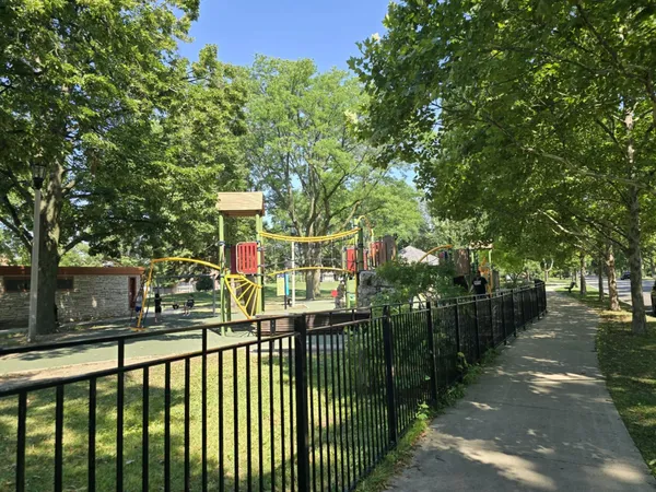 a view of outdoor space with garden and trees