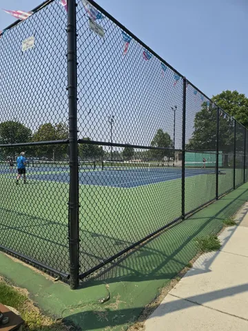 a view of a patio with table and chairs and potted plants