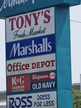 a view of city street with a car parked on the road