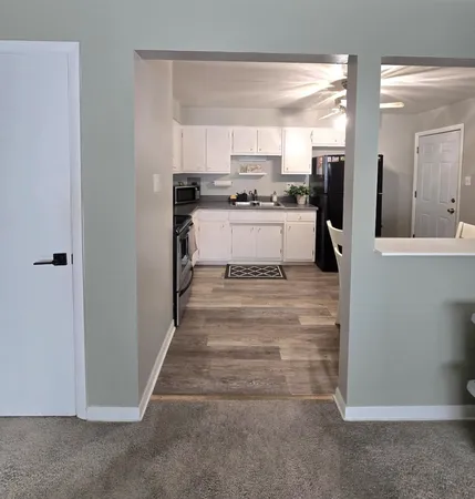 a kitchen with cabinets and stainless steel appliances