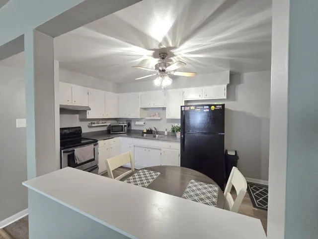 a view of a livingroom with furniture and cabinet
