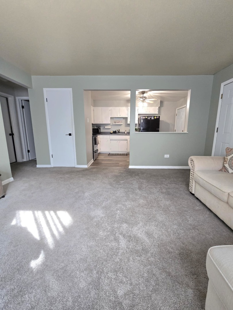 1101 Harlem Avenue, Unit 203 Oak Park, IL 60130 - Photo 10 of 58 a view of a livingroom with furniture and cabinet