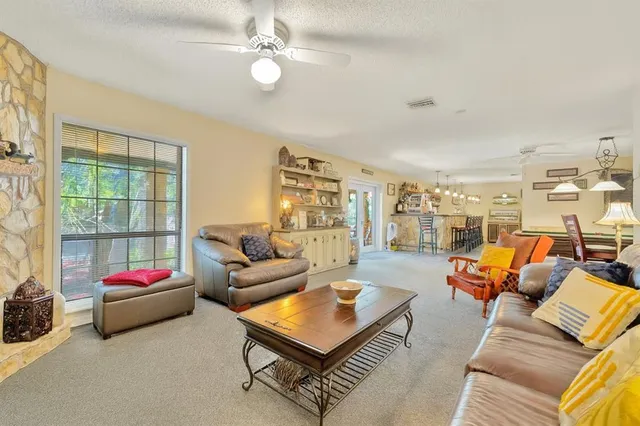 a bathroom with a sink a toilet a mirror and shower