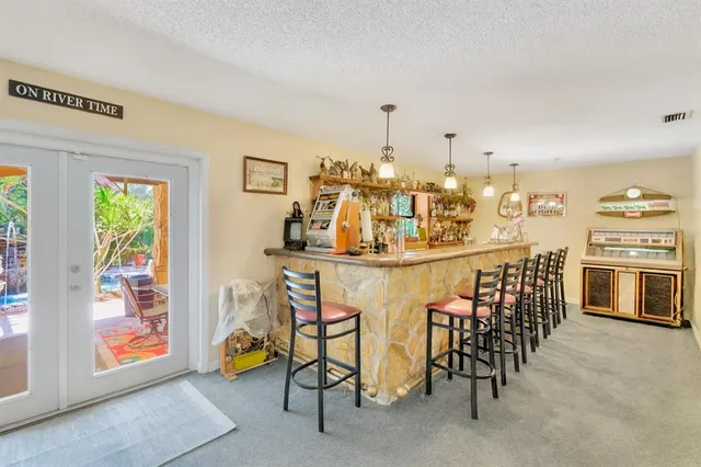 a view of a backyard with plants and a patio