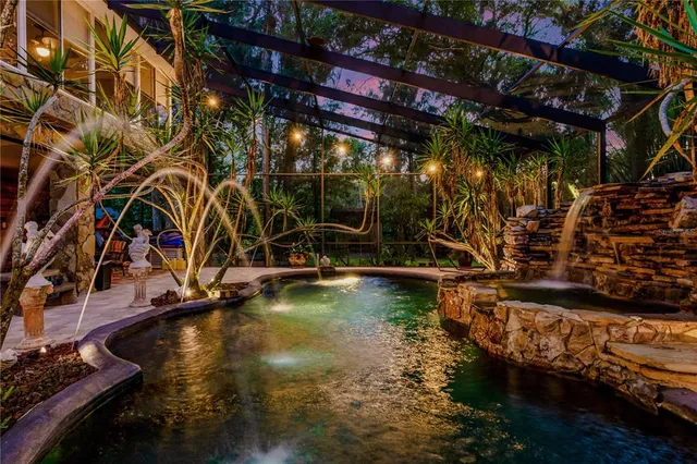 a view of swimming pool with outdoor seating