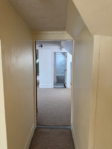 113 West Main Street, Unit 113 Ayer, MA 01432 - Photo 10 of 17 a view of hallway with wooden floor