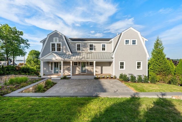 an aerial view of a house with lake view