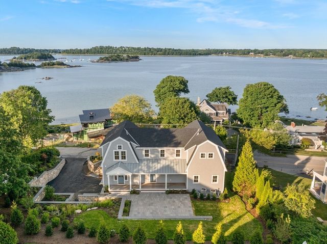 aerial view of a house with a lake view