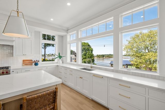 a kitchen with a window a sink and a counter top space