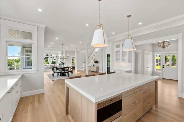 an open kitchen with a table and chairs