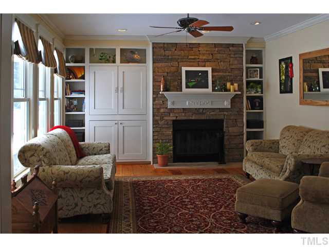 1204 Red Brick Road Garner, NC 27529 - Photo 4 of 12 a living room with furniture and a fireplace