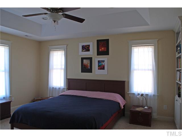 1204 Red Brick Road Garner, NC 27529 - Photo 5 of 12 a bedroom with a bed and window