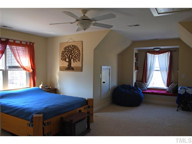1204 Red Brick Road Garner, NC 27529 - Photo 10 of 12 a bedroom with a bed and a window