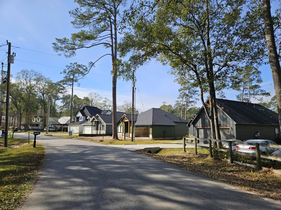 0 Coaltown Road Willis, TX 77378 - Photo 20 of 27 a view of a park with swings and slides