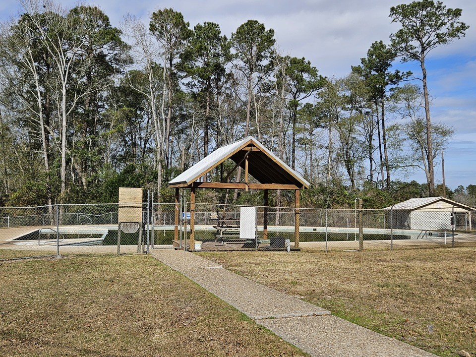 0 Coaltown Road Willis, TX 77378 - Photo 26 of 27 a view of a house with backyard and trees