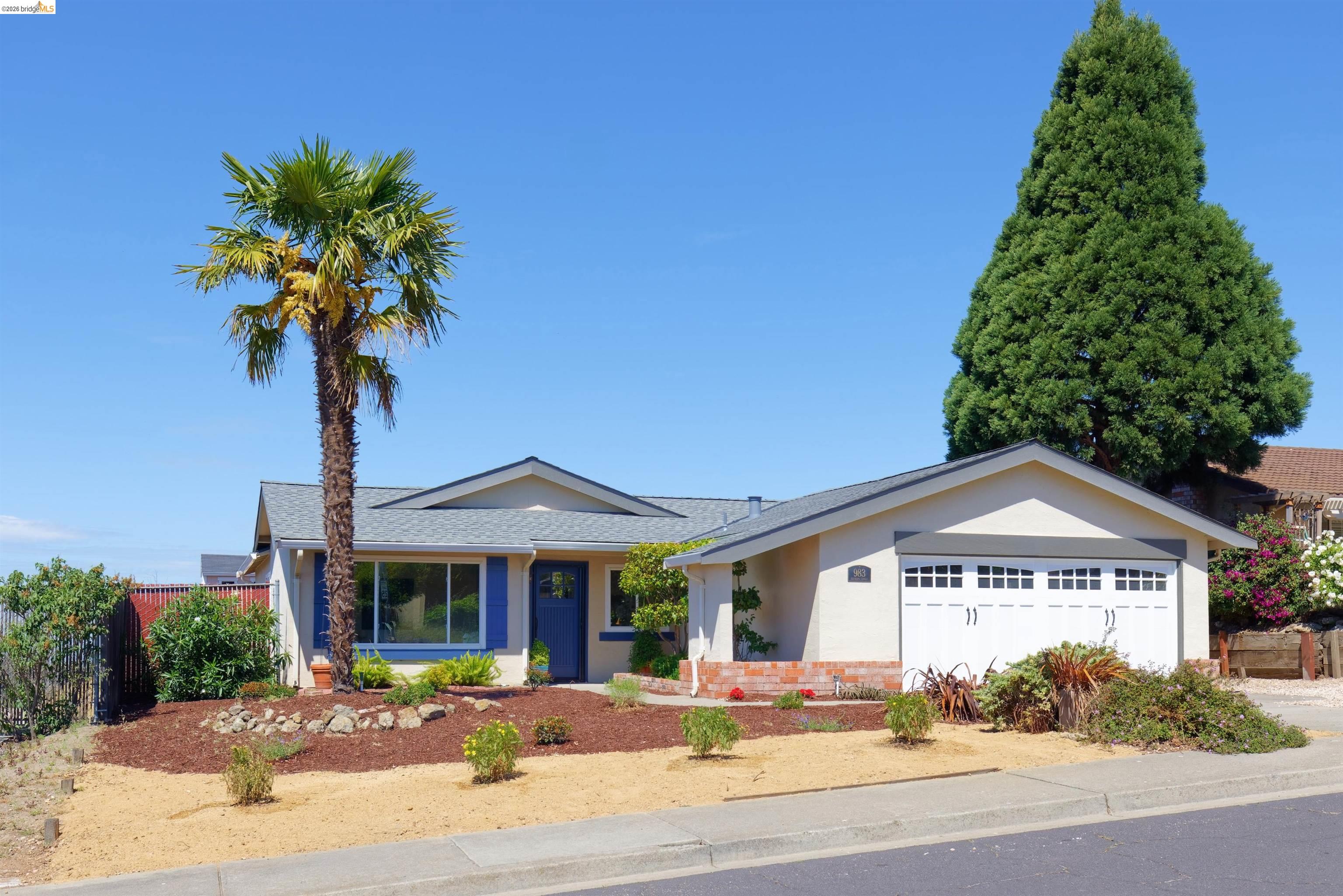 983 Seascape Circle Rodeo, CA 94572 - Photo 3 of 45 Ranch-style house featuring a garage, stucco siding, roof with shingles, and driveway