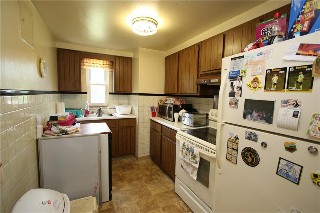 274 Castle Road Castle Shannon, PA 15234 - Photo 4 of 25 Plenty of Wood Cabinets in 11x7 Kitchen w/ Door to Side Porch