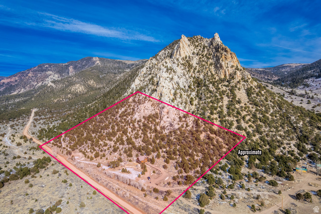 18906 North Canyon Road Whiterocks, UT 84085 - Photo 64 of 65 Aerial view of sparsely populated area with property parcel outlined and a mountainous background