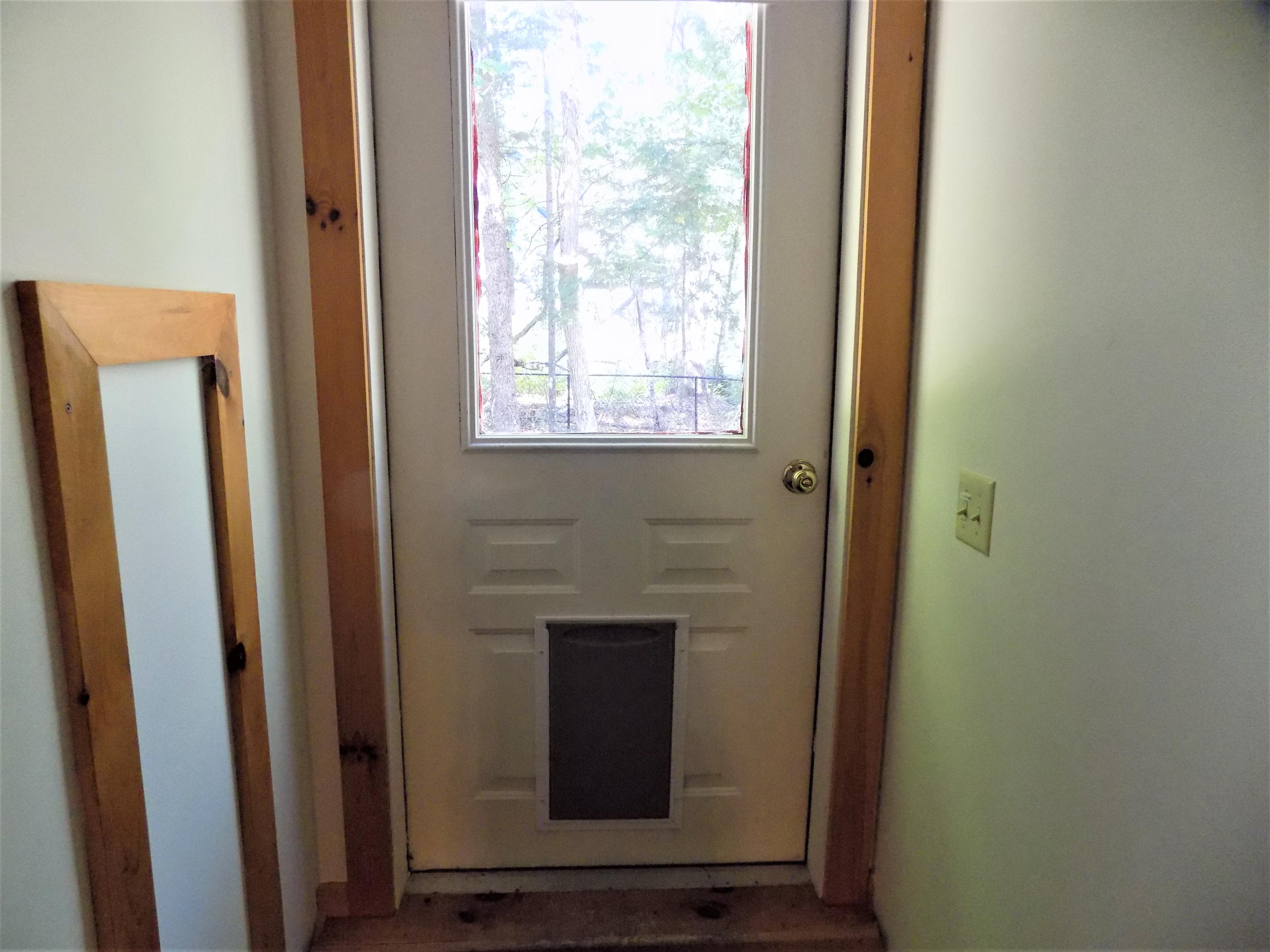 171 Long Point Way Orland, ME 04472 - Photo 36 of 63 Doggie door to fenced area