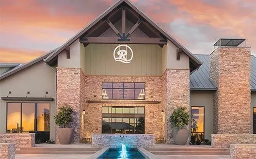 a kitchen with stainless steel appliances granite countertop a sink refrigerator and microwave