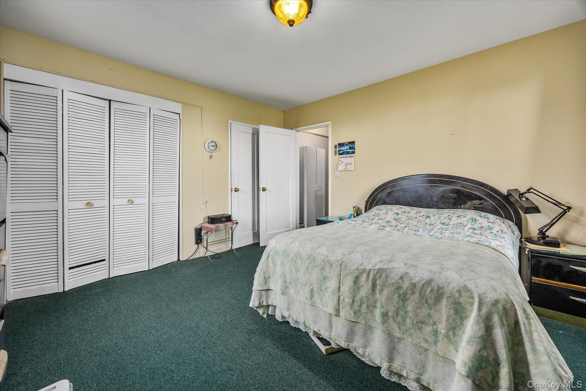 52-35 39th Road, Unit 2C Queens, NY 11377 - Photo 9 of 10 Bedroom featuring carpet floors and a closet