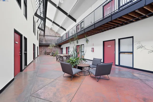 a view of a patio with plants and furniture