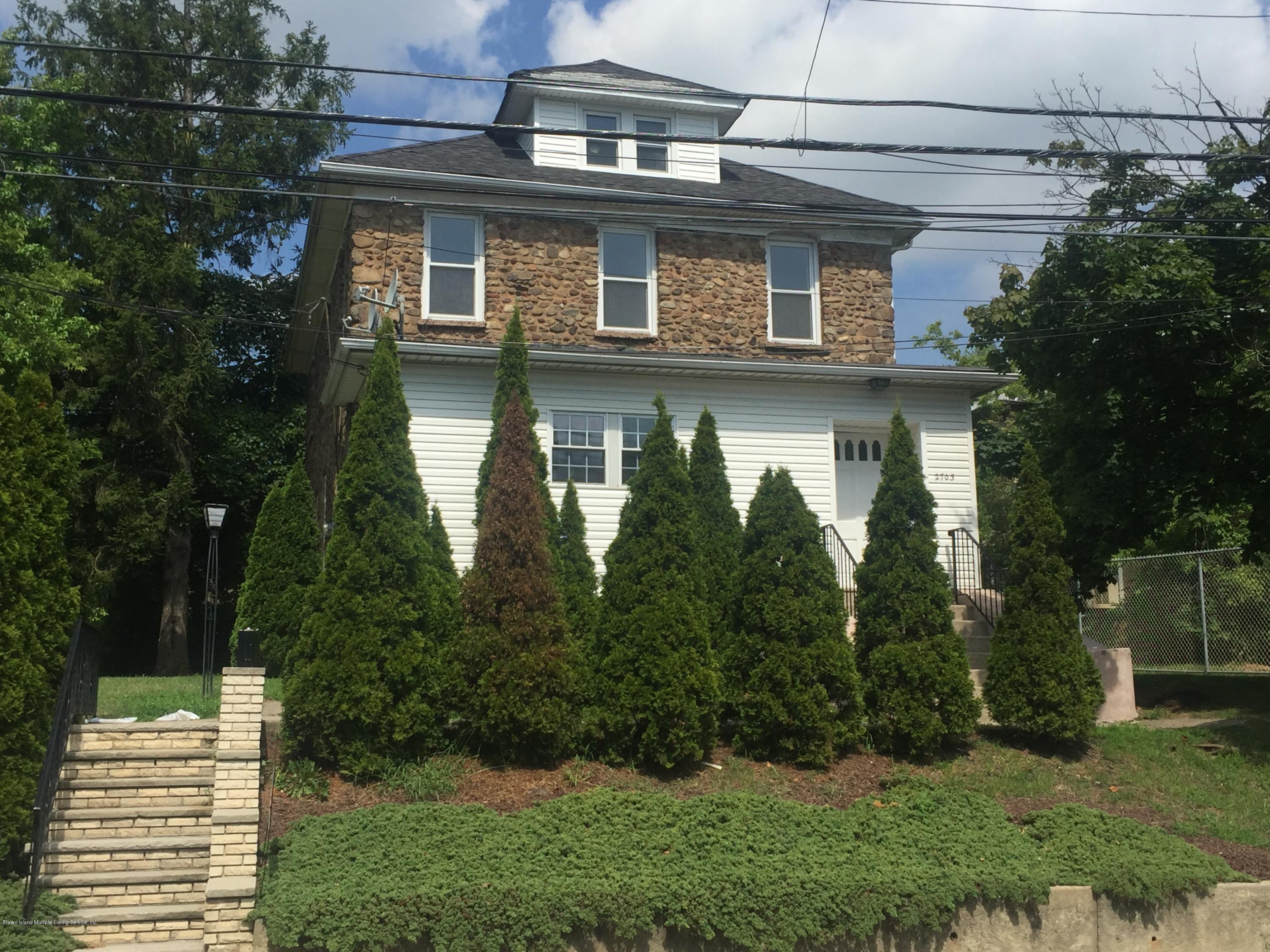 2703 Amboy Road Staten Island, NY 10306 - Photo 2 of 8 a front view of a house with garden