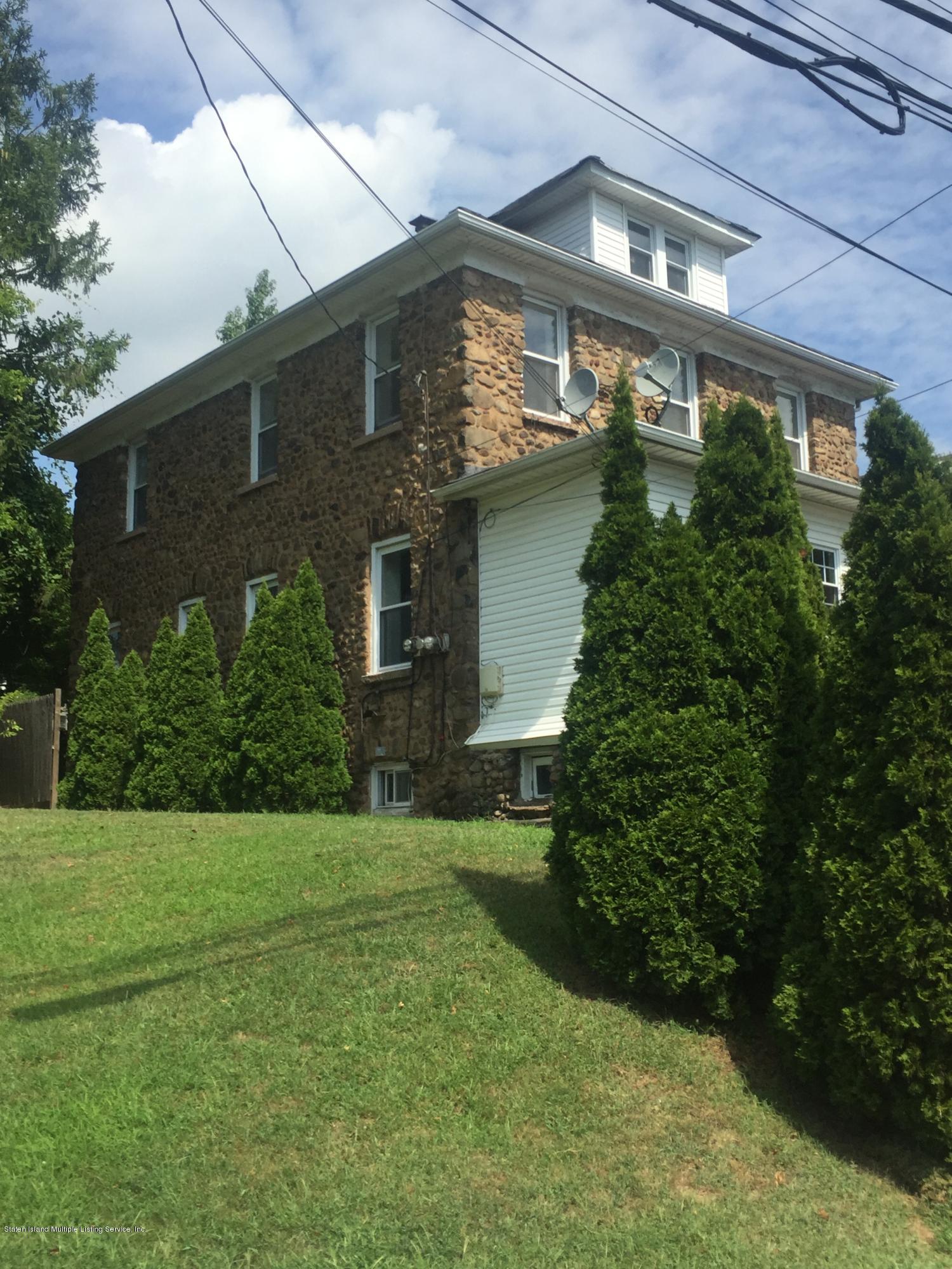 2703 Amboy Road Staten Island, NY 10306 - Photo 3 of 8 a view of a house with a yard