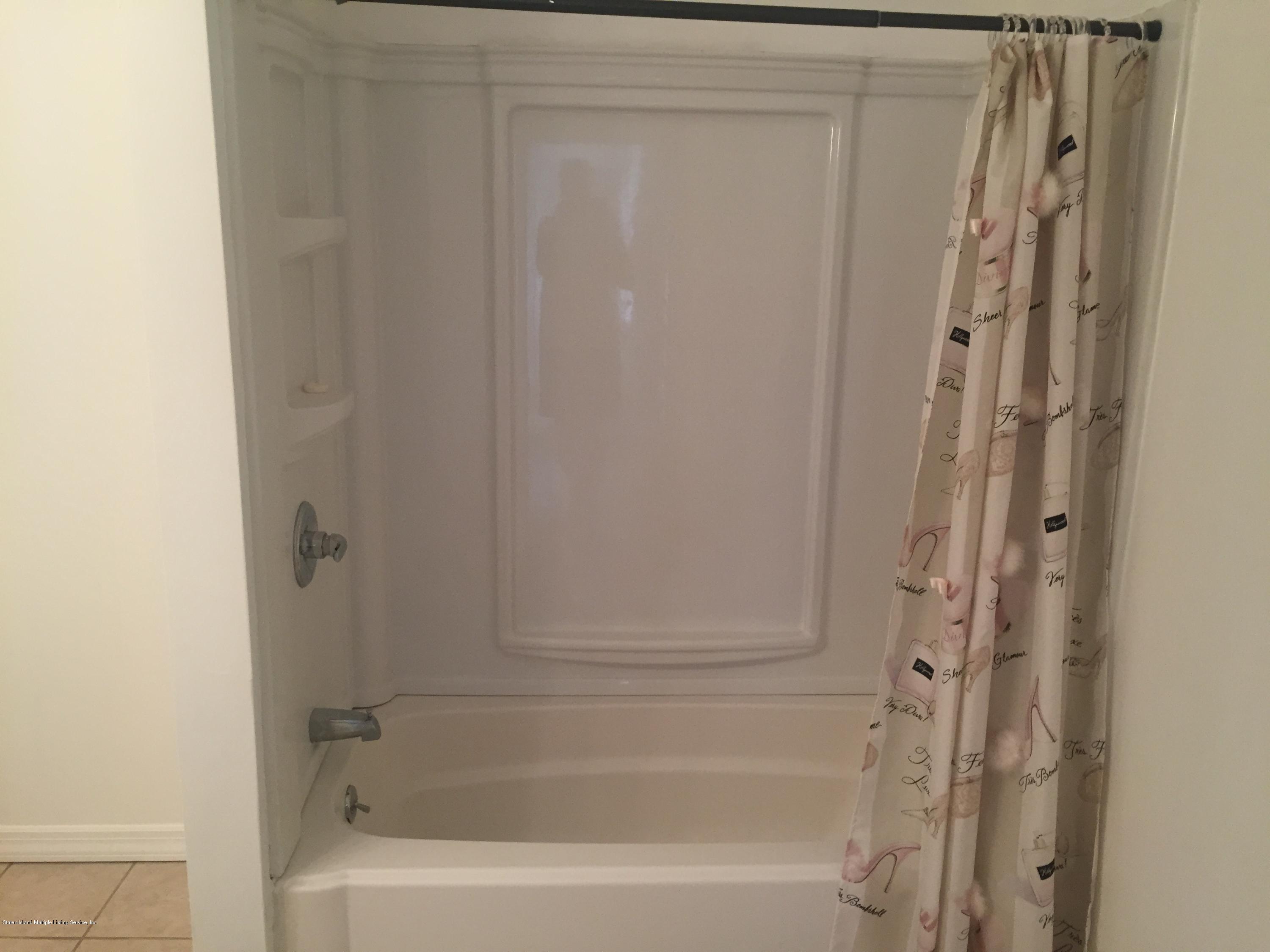 2703 Amboy Road Staten Island, NY 10306 - Photo 7 of 8 a bathroom with a bathtub