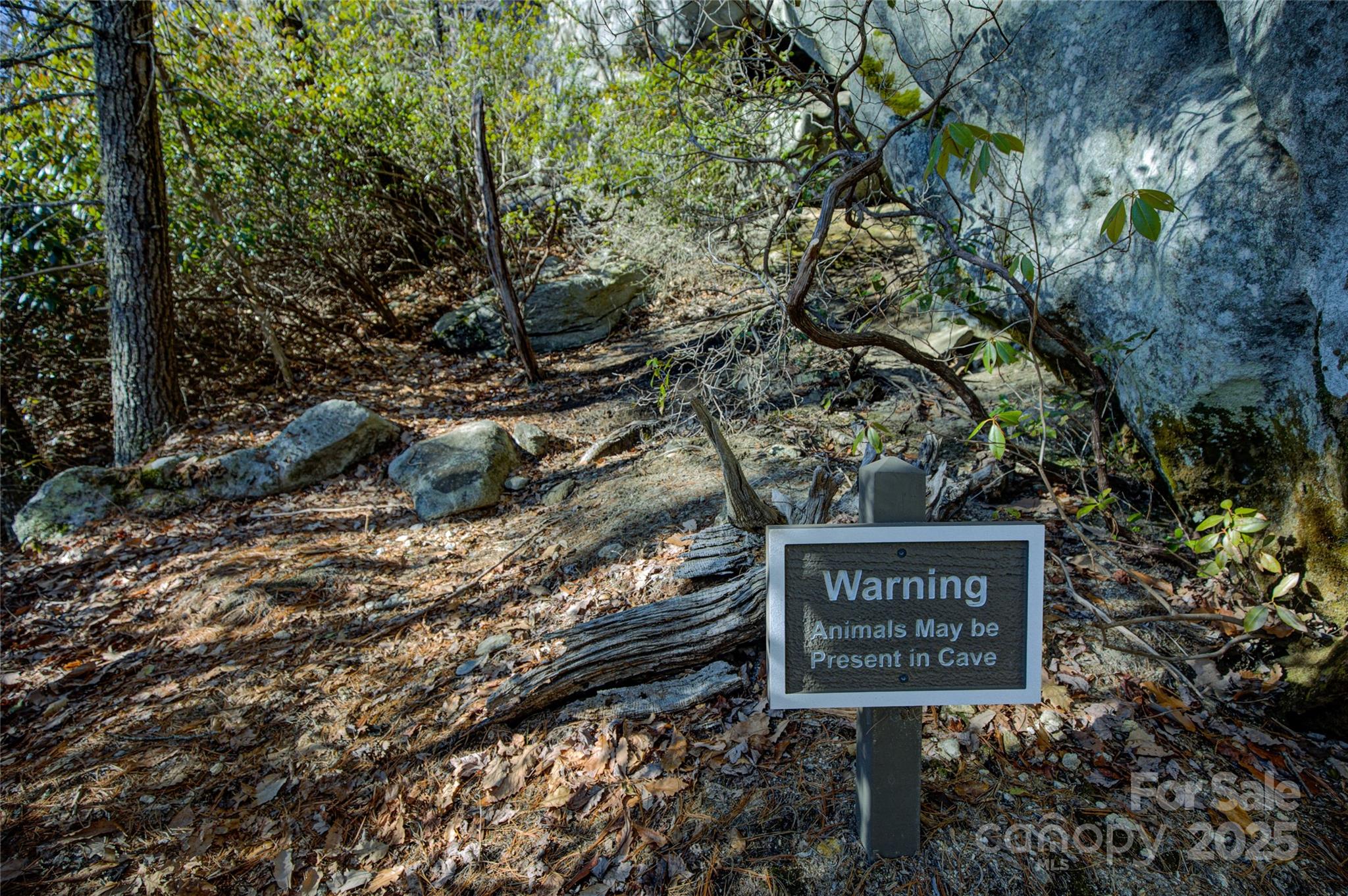 135 Lonesome Valley Road Sapphire, NC 28774 - Photo 17 of 46 a sign that is on a brick wall