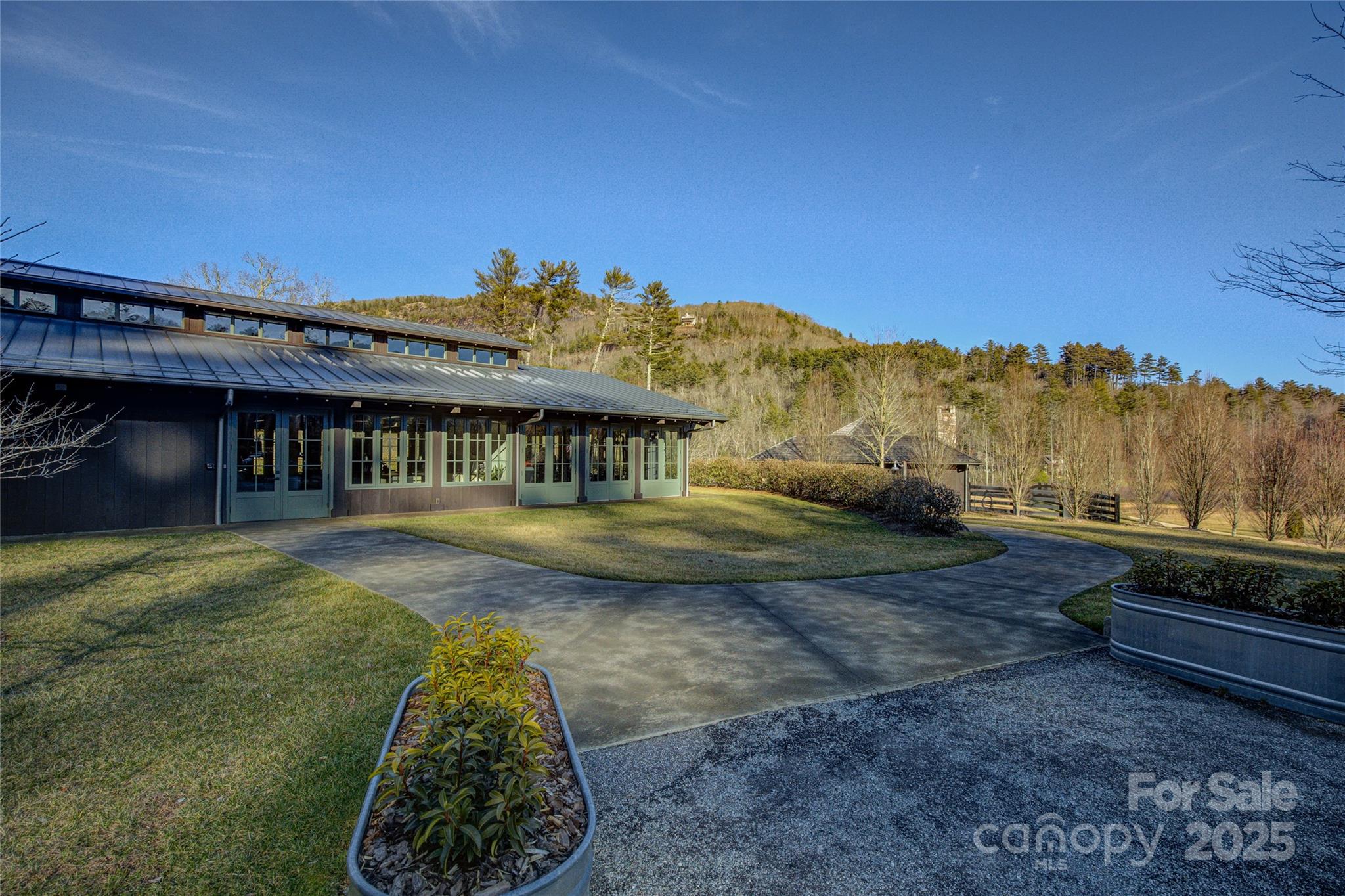 135 Lonesome Valley Road Sapphire, NC 28774 - Photo 3 of 46 a view of a house with a yard