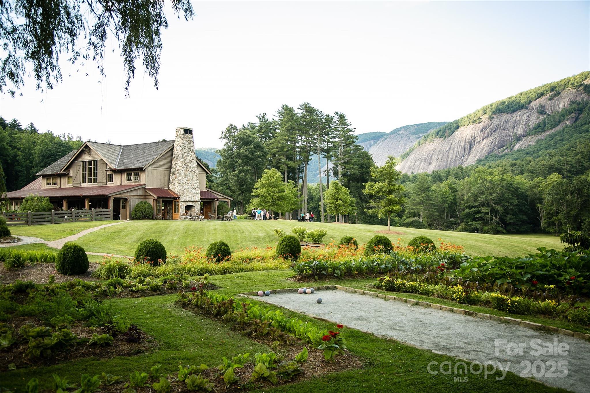 135 Lonesome Valley Road Sapphire, NC 28774 - Photo 39 of 46 a view of an house with outdoor space and garden