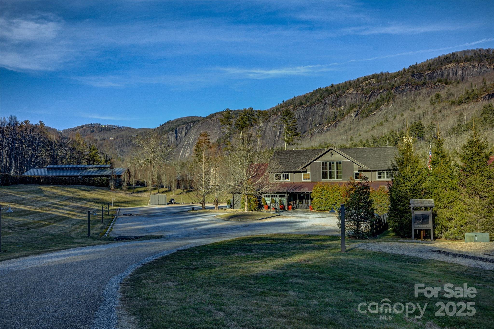 135 Lonesome Valley Road Sapphire, NC 28774 - Photo 5 of 46 a front view of a house with a yard