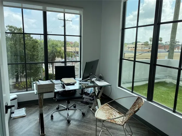 a workspace with furniture and a window