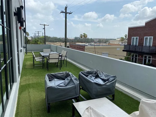 a view of a terrace with furniture