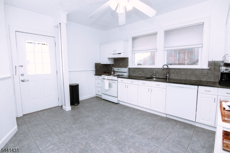 306 Springfield Avenue, Unit 1 Summit, NJ 07901 - Photo 11 of 17 a kitchen with granite countertop a sink and a stove