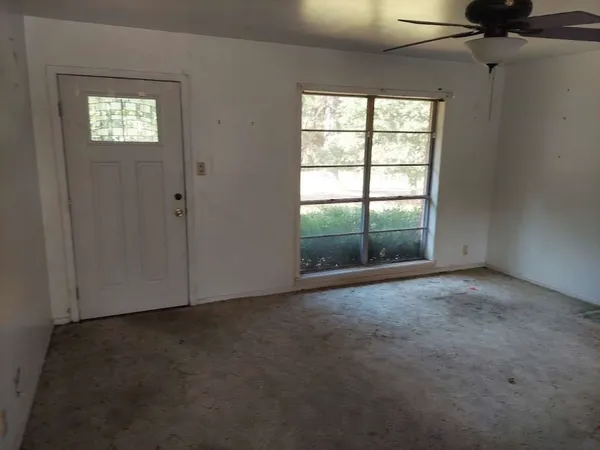 an empty room with windows