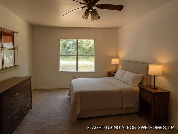 a bedroom with a bed and window