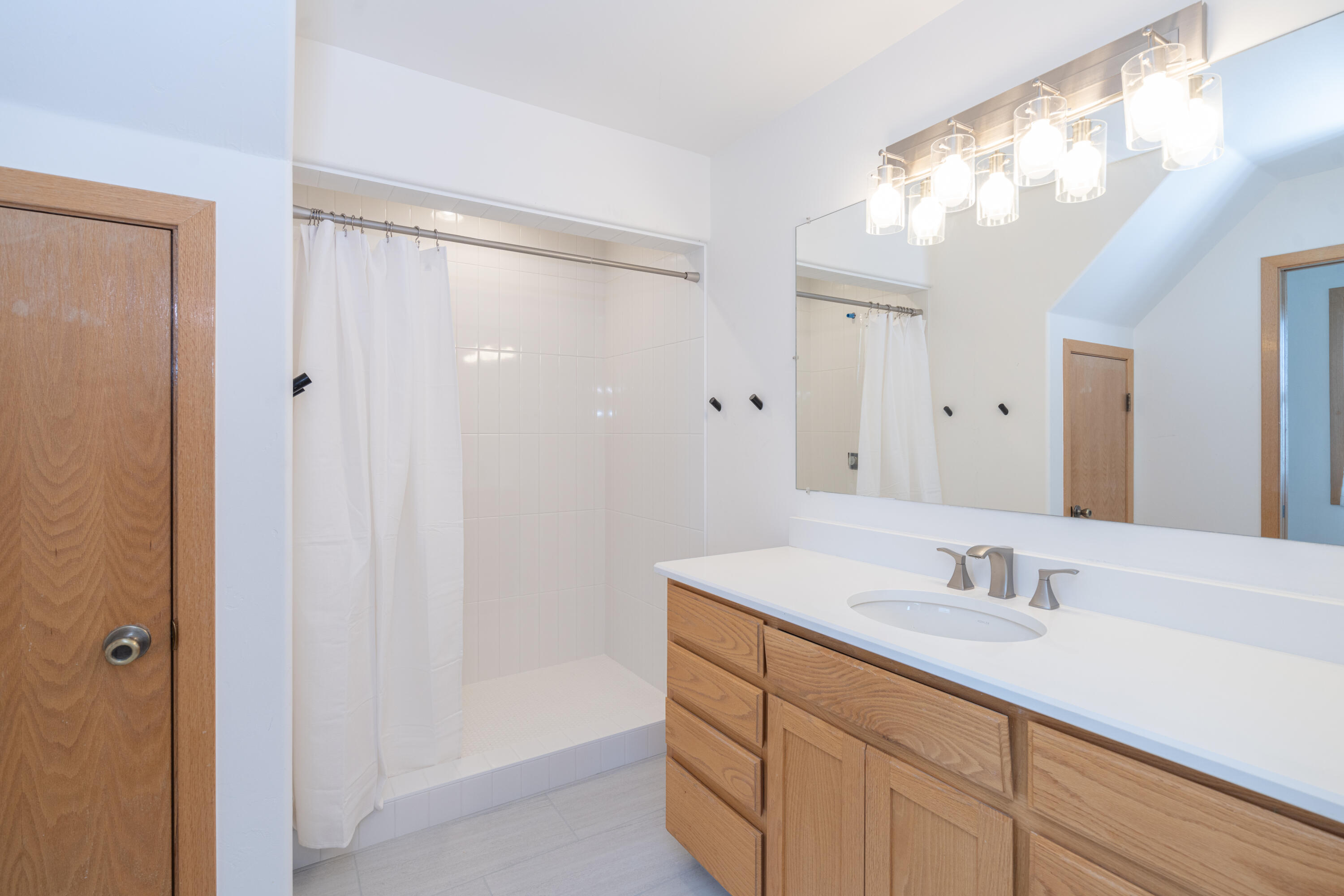 787 Pine Drive Ridgway, CO 81432 - Photo 26 of 42 a bathroom with a sink double vanity and a mirror