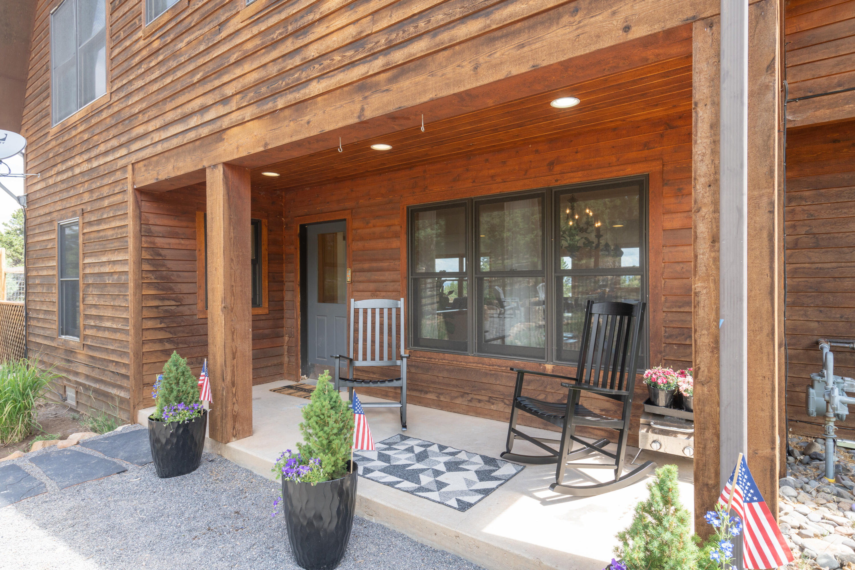 787 Pine Drive Ridgway, CO 81432 - Photo 30 of 42 a view of a porch with chairs and potted plants