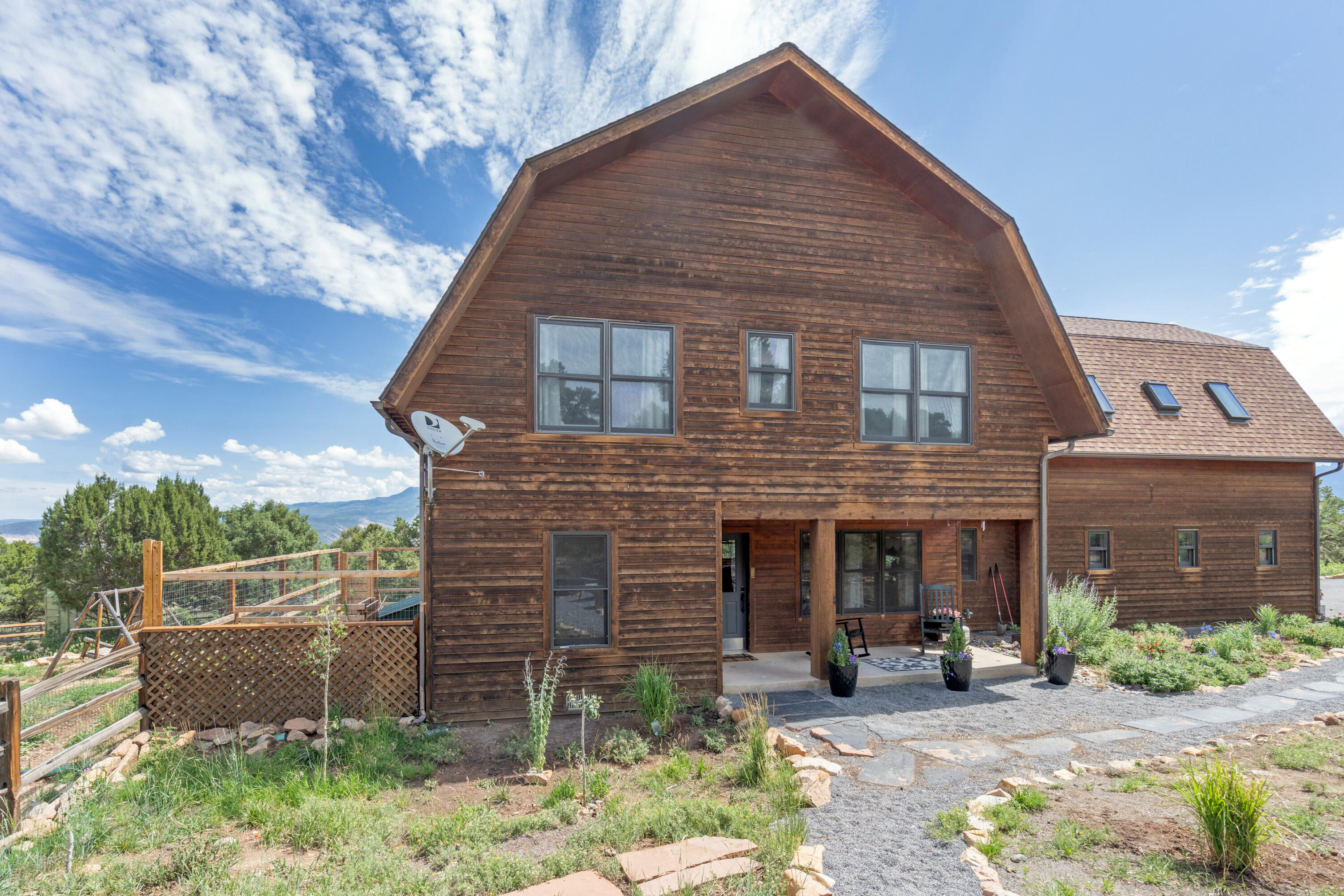 787 Pine Drive Ridgway, CO 81432 - Photo 36 of 42 a front view of a house with garden