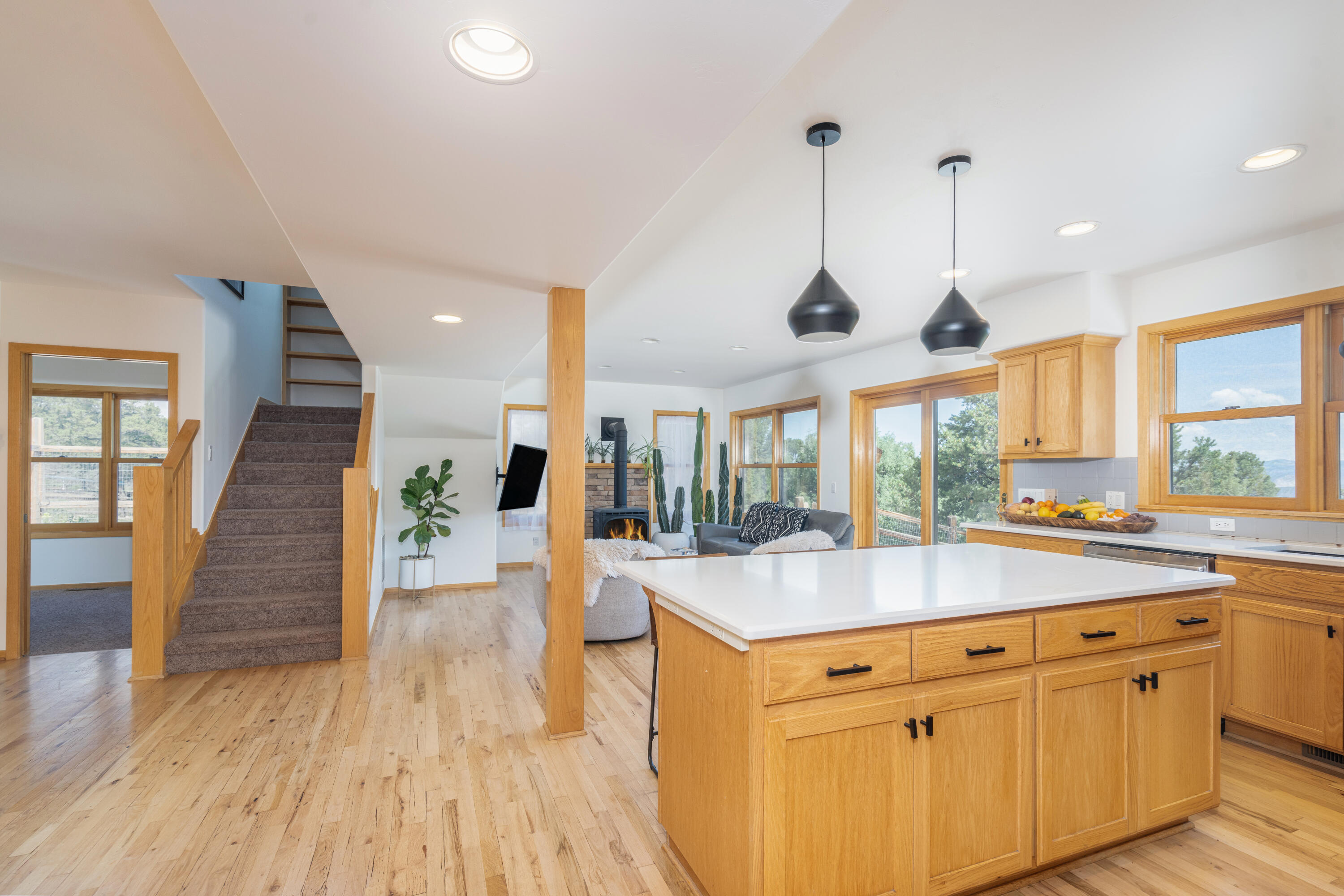 787 Pine Drive Ridgway, CO 81432 - Photo 4 of 42 an open kitchen with wooden floor and a sink