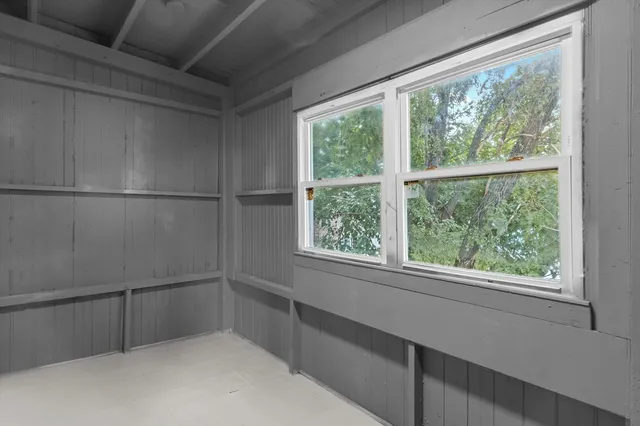 a view of an empty room with a window