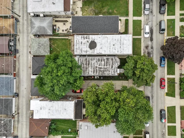 aerial view of a street with a building in the background