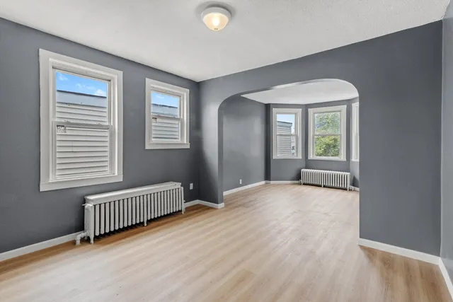 a view of an empty room with a window