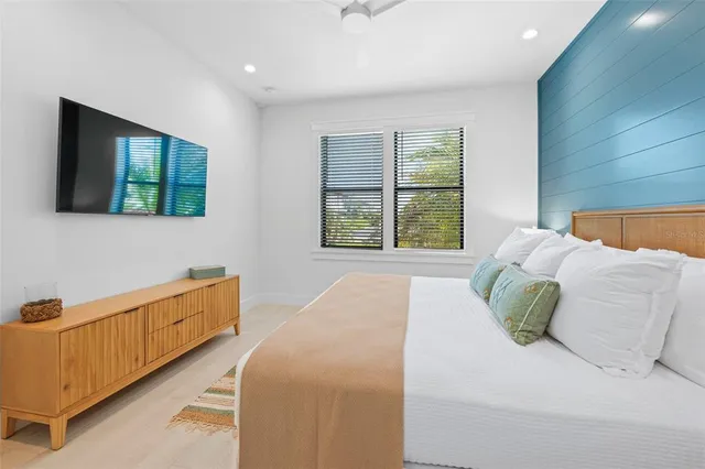 a bathroom with a sink mirror vanity and toilet